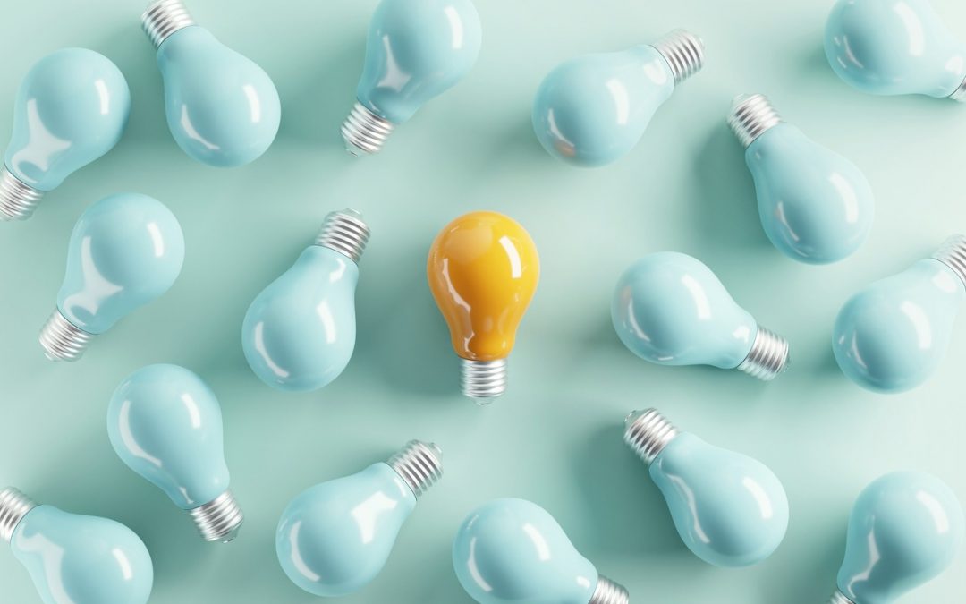 Minimal idea of yellow light bulb surrounded with blue bulbs on pastel background. 3d rendering. Idea creative Concept. Copy space.